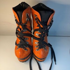 Orange lace-up heeled platform construction booties